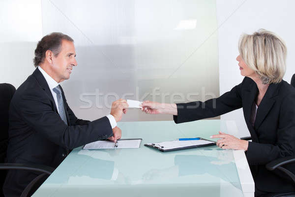 Businesspeople Exchanging Visiting Card In Office Stock photo © AndreyPopov