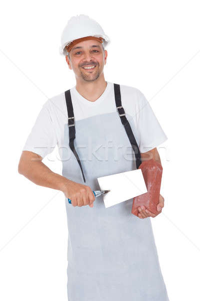 Portrait of smiling bricklayer Stock photo © AndreyPopov