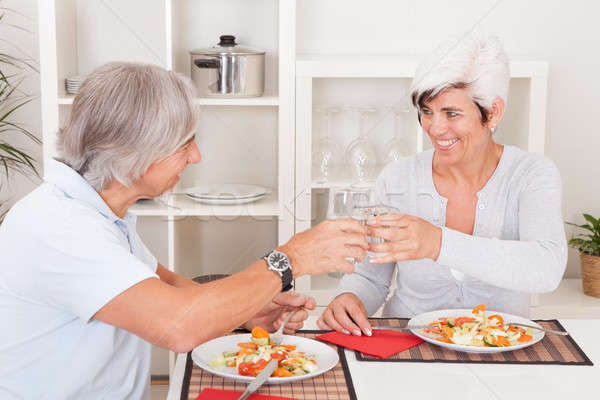 Senior couple eating a meal Stock photo © AndreyPopov