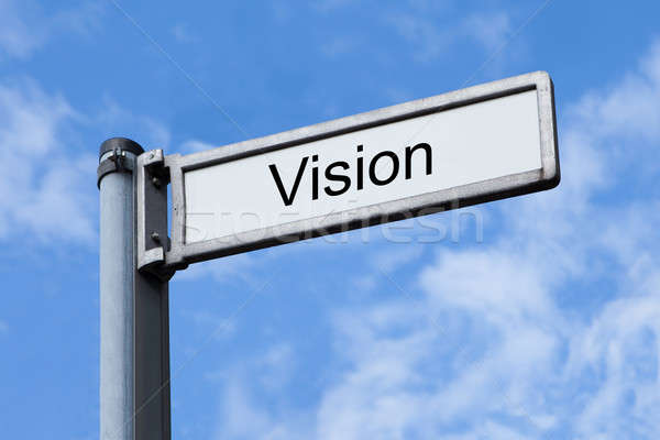 Signpost With Vision Sign Against Sky Stock photo © AndreyPopov