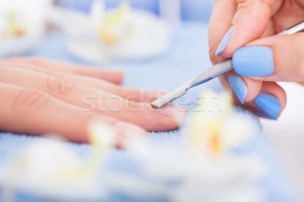 Manicurist Removing Cuticle From Nail Stock photo © AndreyPopov