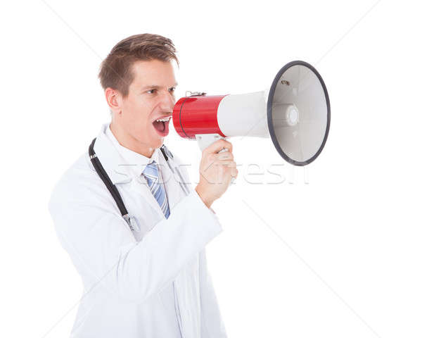Médecin de sexe masculin mégaphone blanche sourire médecin [[stock_photo]] © AndreyPopov