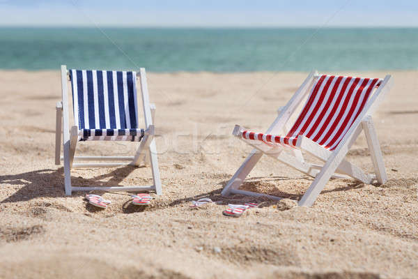 Two Deckchairs On Beach Stock photo © AndreyPopov