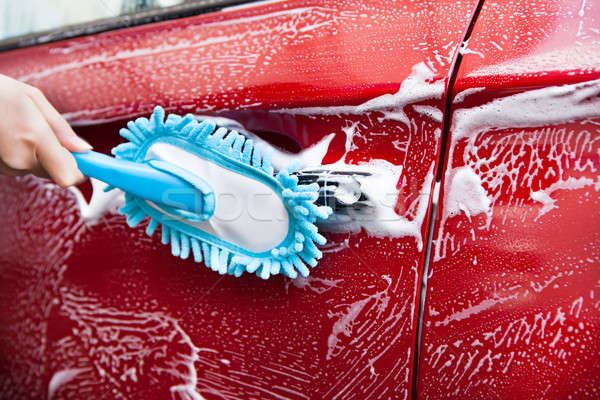 Hand With Blue Brush Washing Red Car Stock photo © AndreyPopov