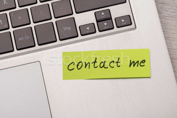 Contact Me Sticky Note On Laptop Stock photo © AndreyPopov