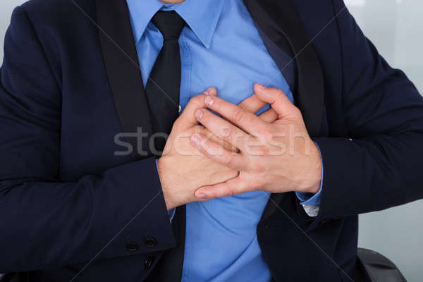 Businessman With Hand On Chest Stock photo © AndreyPopov