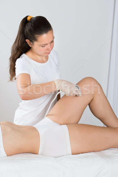 Nő lézer kezelés comb közelkép fiatal nő Stock fotó © AndreyPopov