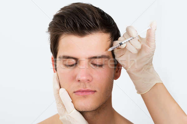 Person Hands Injecting Syringe With Botox Stock photo © AndreyPopov