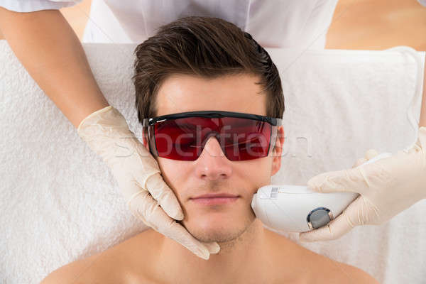 Beautician Giving Laser Epilation Treatment To Man Face Stock photo © AndreyPopov