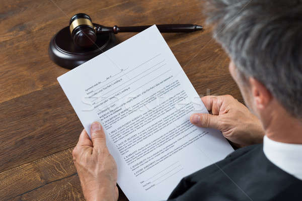 Judge Reading Document In Courtroom Stock photo © AndreyPopov