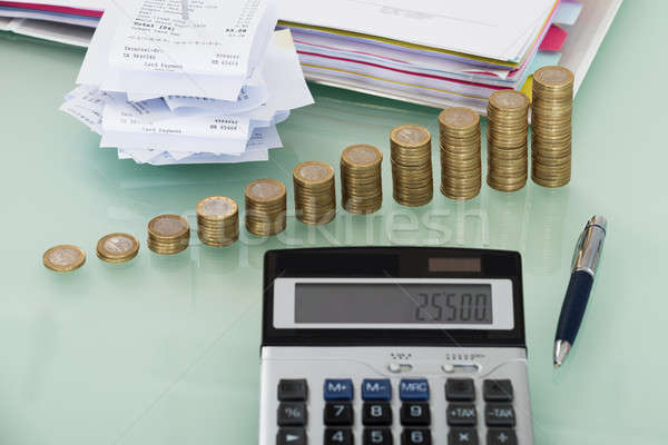 Receipts With Calculator And Money On Desk Stock photo © AndreyPopov