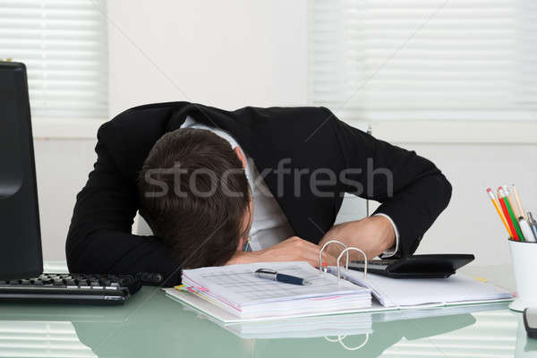 Businessman Sleeping With Invoice On Desk Stock photo © AndreyPopov