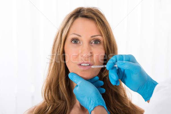 Woman Receiving Cosmetic Injection On Lip Stock photo © AndreyPopov