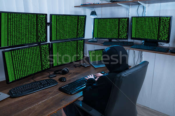 Boy Stealing Information From Multiple Computers Stock photo © AndreyPopov