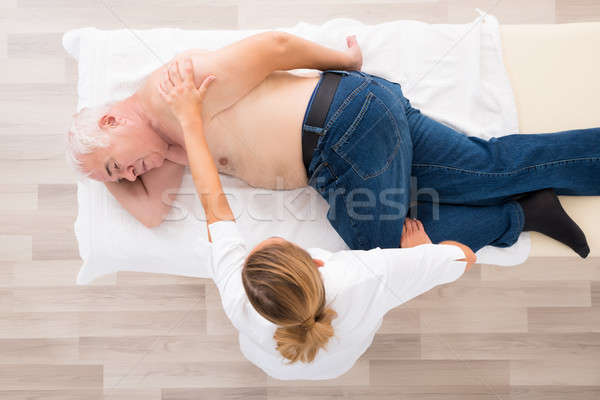 Masseur massage senior man Stockfoto © AndreyPopov