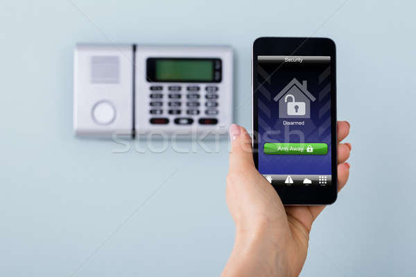 Person Arming The System With Remote Controller Stock photo © AndreyPopov