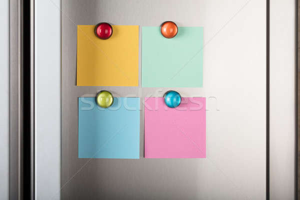Blank Notes Attached With Colorful Magnetic Thumbtacks Stock photo © AndreyPopov