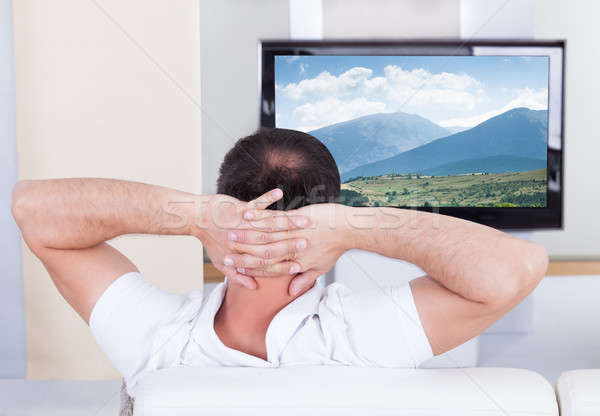 человека Смотря телевизор домой портрет сидят диване Сток-фото © AndreyPopov