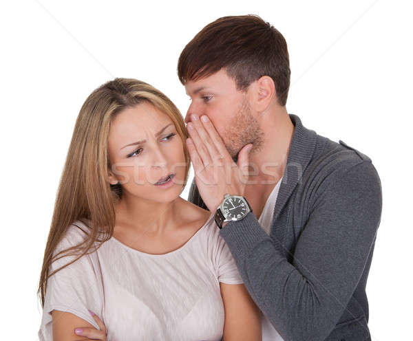 Man whispering in a woman's ear Stock photo © AndreyPopov