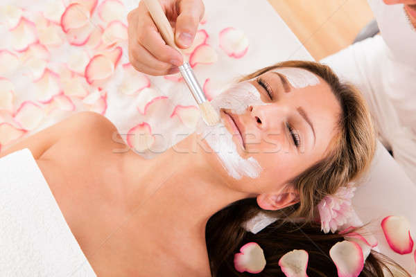 Beautician applying a face mask Stock photo © AndreyPopov