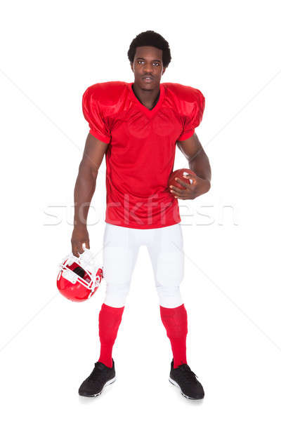 American Football Player Holding Rugby Ball Stock photo © AndreyPopov