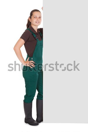 Young Female Gardner Holding Placard Stock photo © AndreyPopov