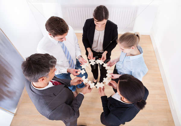 Business People Holding Jigsaw Puzzle Stock photo © AndreyPopov