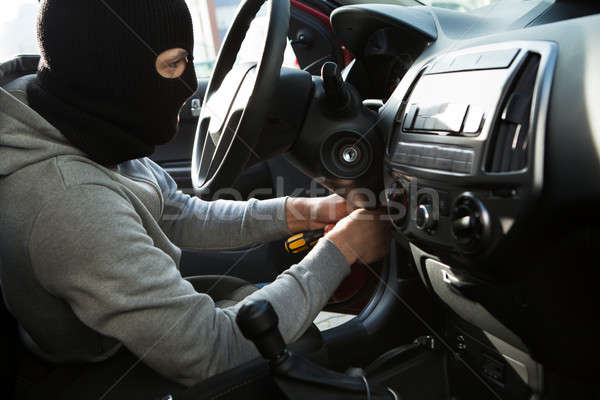 Thief Using Screwdriver In Car Stock photo © AndreyPopov