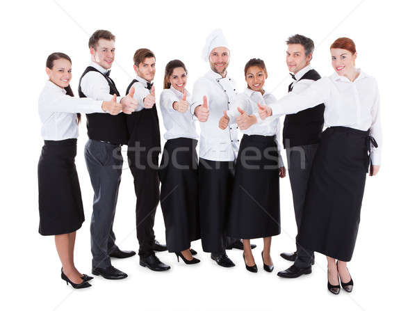 Stock photo: Waiters and waitresses showing thumbs up sign