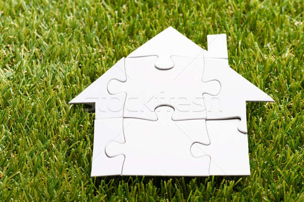 Stock photo: Puzzle House On Grass