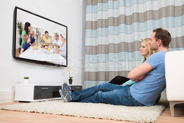 Stock photo: Couple Watching Television In Living Room