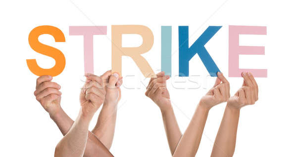 Stock photo: Hands Holding The Word Strike