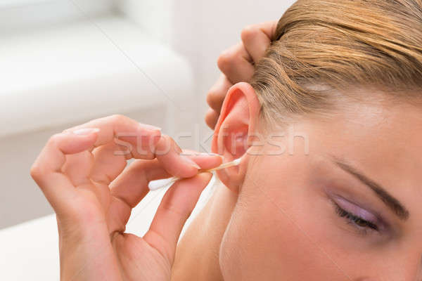 Woman Cleaning Ear Stock photo © AndreyPopov