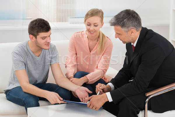 Consultant Showing Project Investment To Couple Stock photo © AndreyPopov