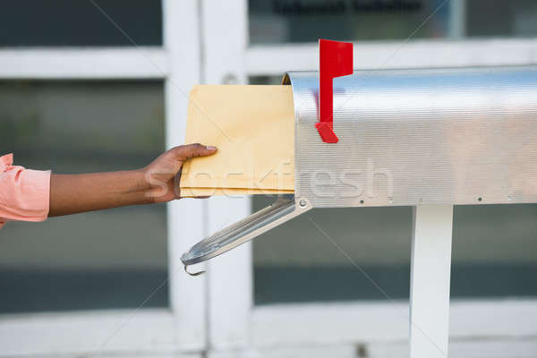 Person Putting Letters In Mailbox Stock photo © AndreyPopov