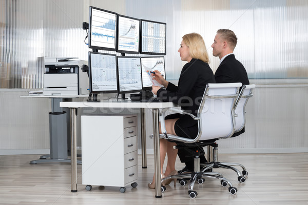 Financial Workers Analyzing Data In Office Stock photo © AndreyPopov