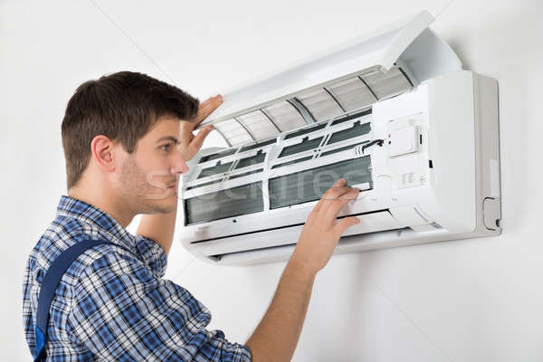 Technician Repairing Air Conditioner Stock photo © AndreyPopov