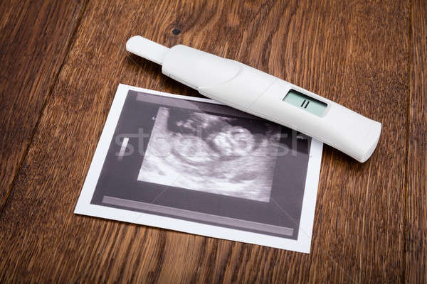 Pregnancy Kit On Wooden Desk Stock photo © AndreyPopov