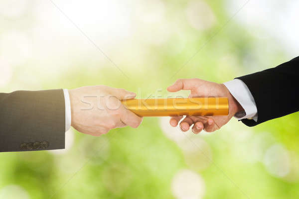 Two Businessman's Passing A Golden Relay Baton Stock photo © AndreyPopov