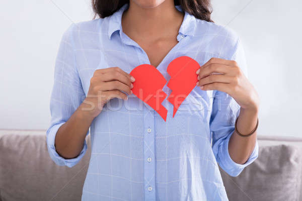 Woman Holding Broken Red Valentine Paper Heart Stock photo © AndreyPopov