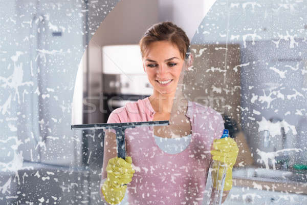 Woman Wearing Yellow Gloves Cleaning Window Stock photo © AndreyPopov