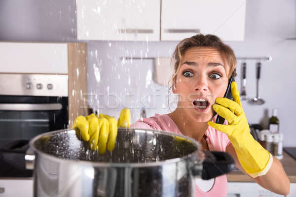 Femme appelant plombier eau plafond Photo stock © AndreyPopov
