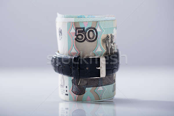 Rolled Up Russian Rubles Tied With Belt Stock photo © AndreyPopov