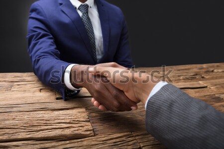 Businessman Showing Middle Finger To His Partner Stock photo © AndreyPopov