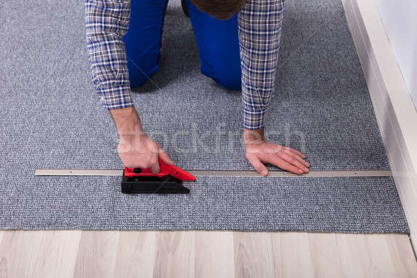 Carpet Fitter Installing Carpet With Tool Stock Photo C Andriy