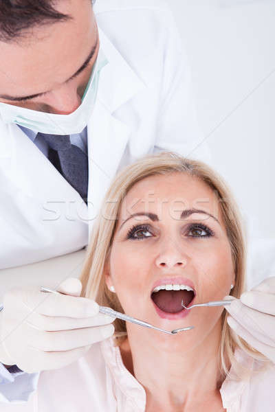 Dentist Examining Patient Stock photo © AndreyPopov