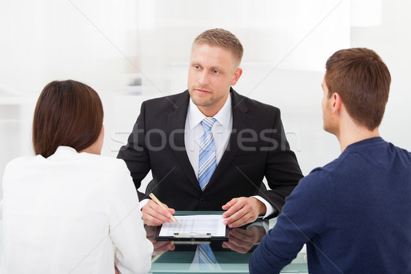 Pár tanácsadás pénzügyi tanácsadó hátsó nézet fiatal pér irodai asztal Stock fotó © AndreyPopov
