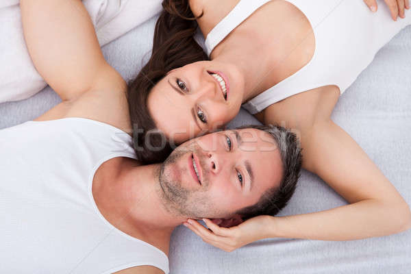 Happy Young Couple Lying On Back Stock photo © AndreyPopov