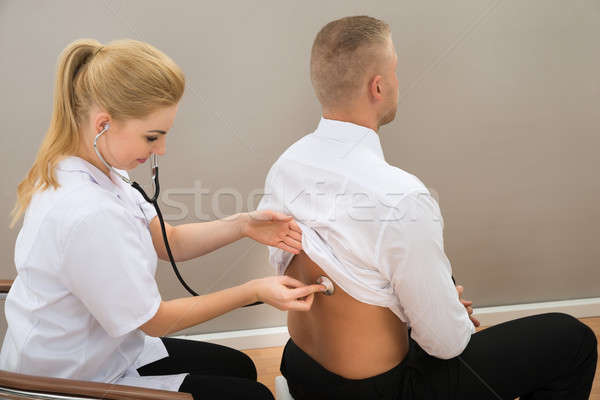 Stock photo: Doctor Examine Patient's Back