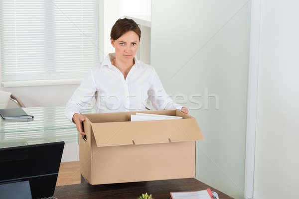 Businesswoman Packing Her Belongings Stock photo © AndreyPopov